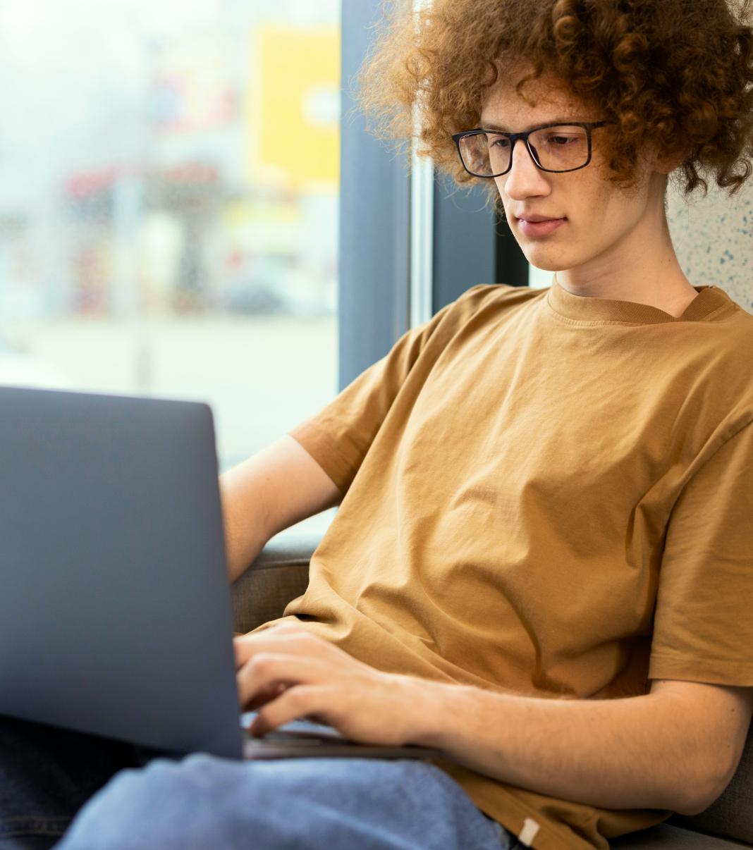 A person typing on a laptop computer